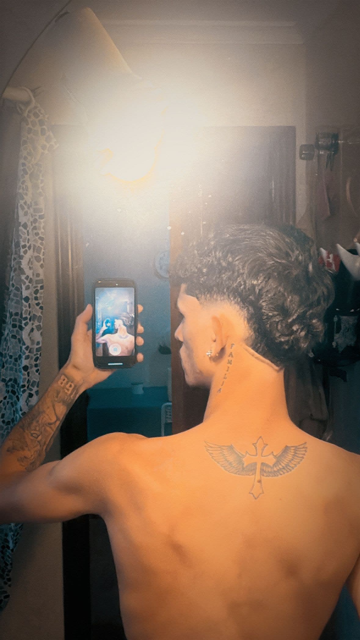 A client shows off the haircut result from El Salon de la Fama